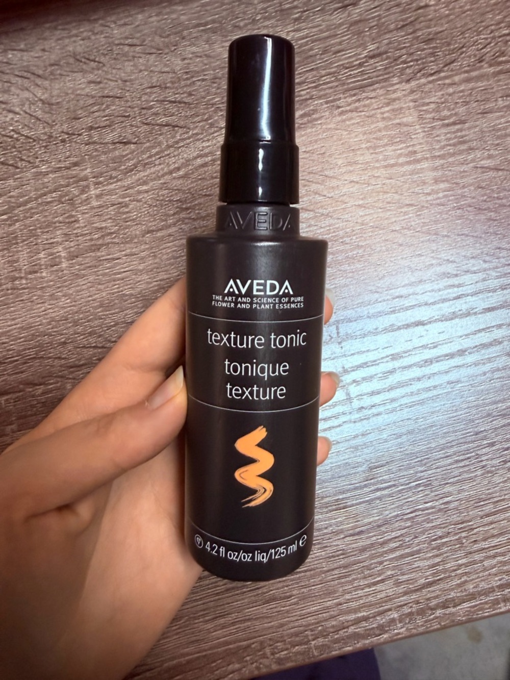 Aveda Texture Tonic Spray — Black Bottle with Orange Accent